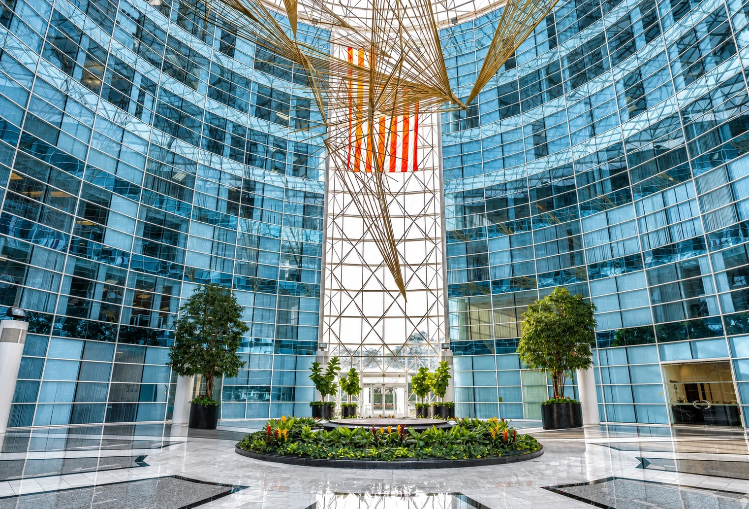 Glass office atrium representing Current Capital property conversations
