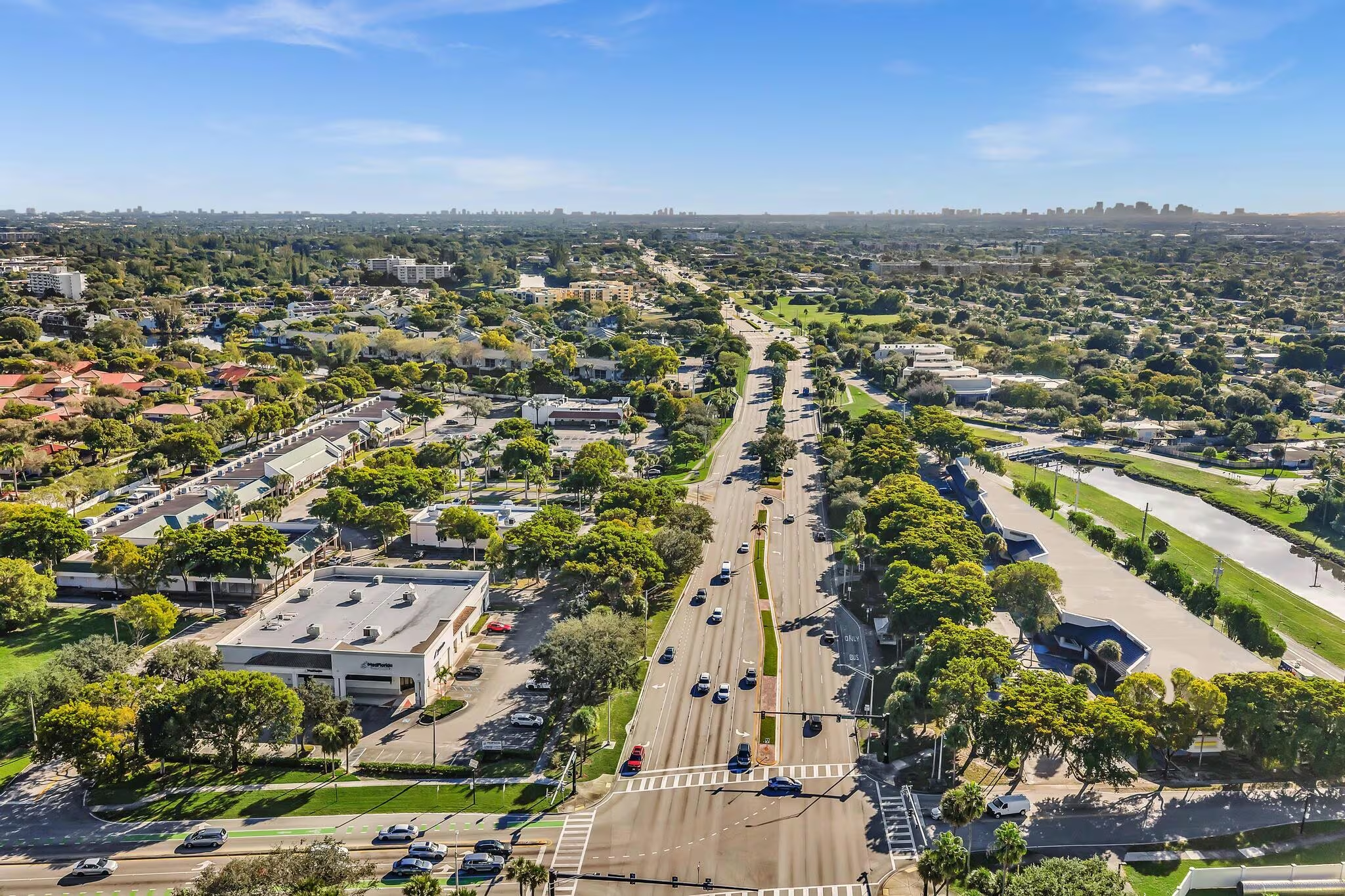 Aerial view of a South Florida commercial corridor and surrounding neighborhood